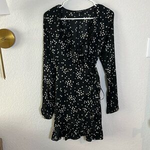 Wrap dress. Black dress with small white stars. Silk like material.